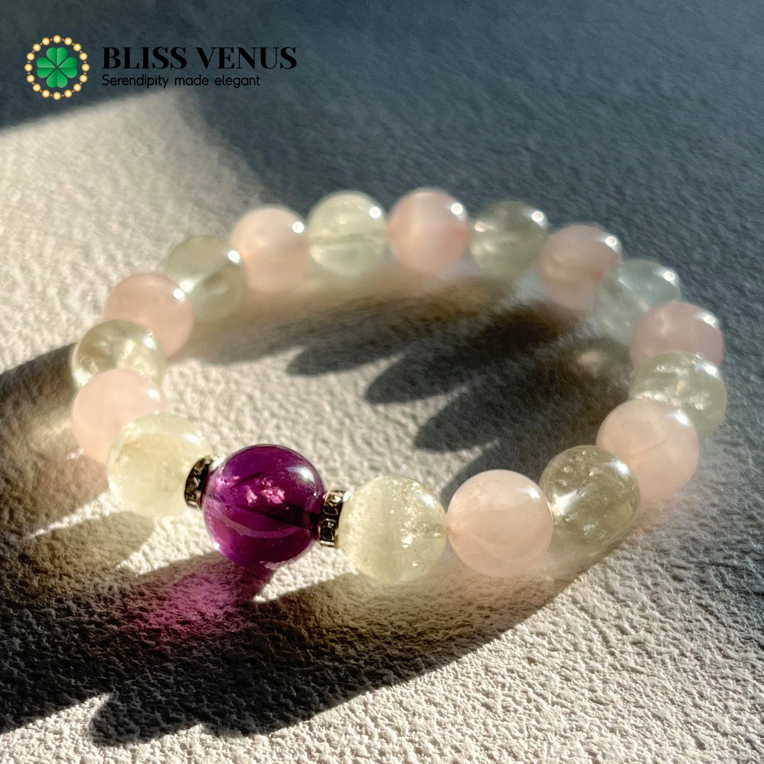 Close-up of pink green and purple crystal bracelet showing natural rose quartz, aventurine and amethyst colors