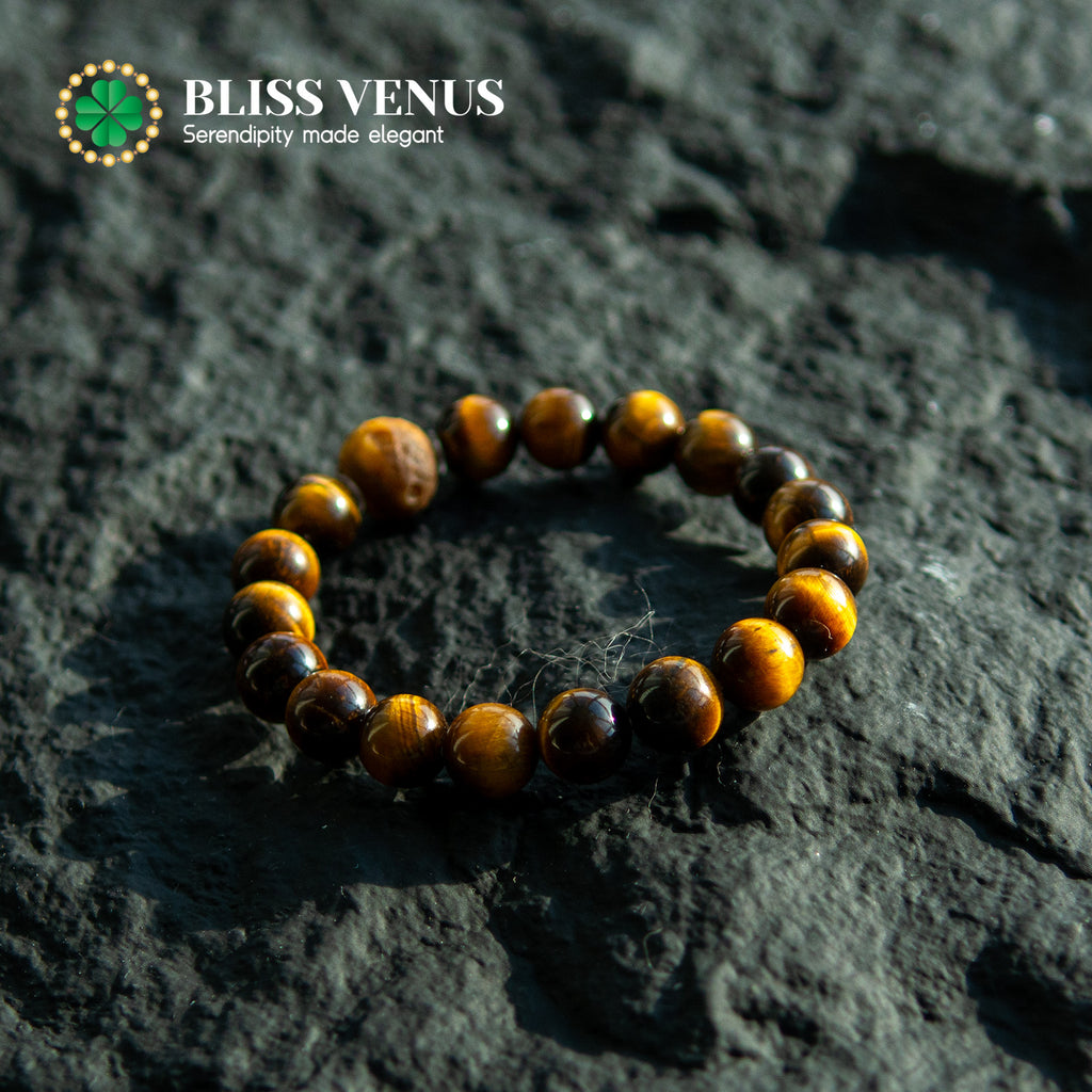 Close-up of yellow tiger eye bracelet showing golden chatoyant effect and natural stone patterns