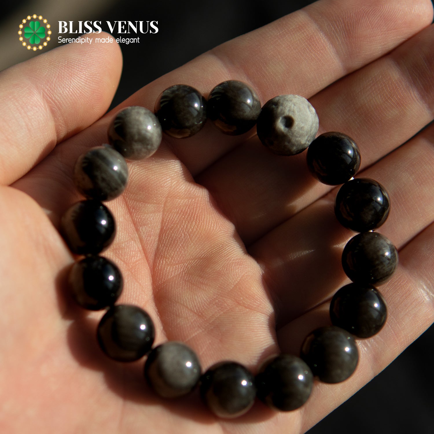 Full view of moon design obsidian bracelet, removes negative energy and enhances security