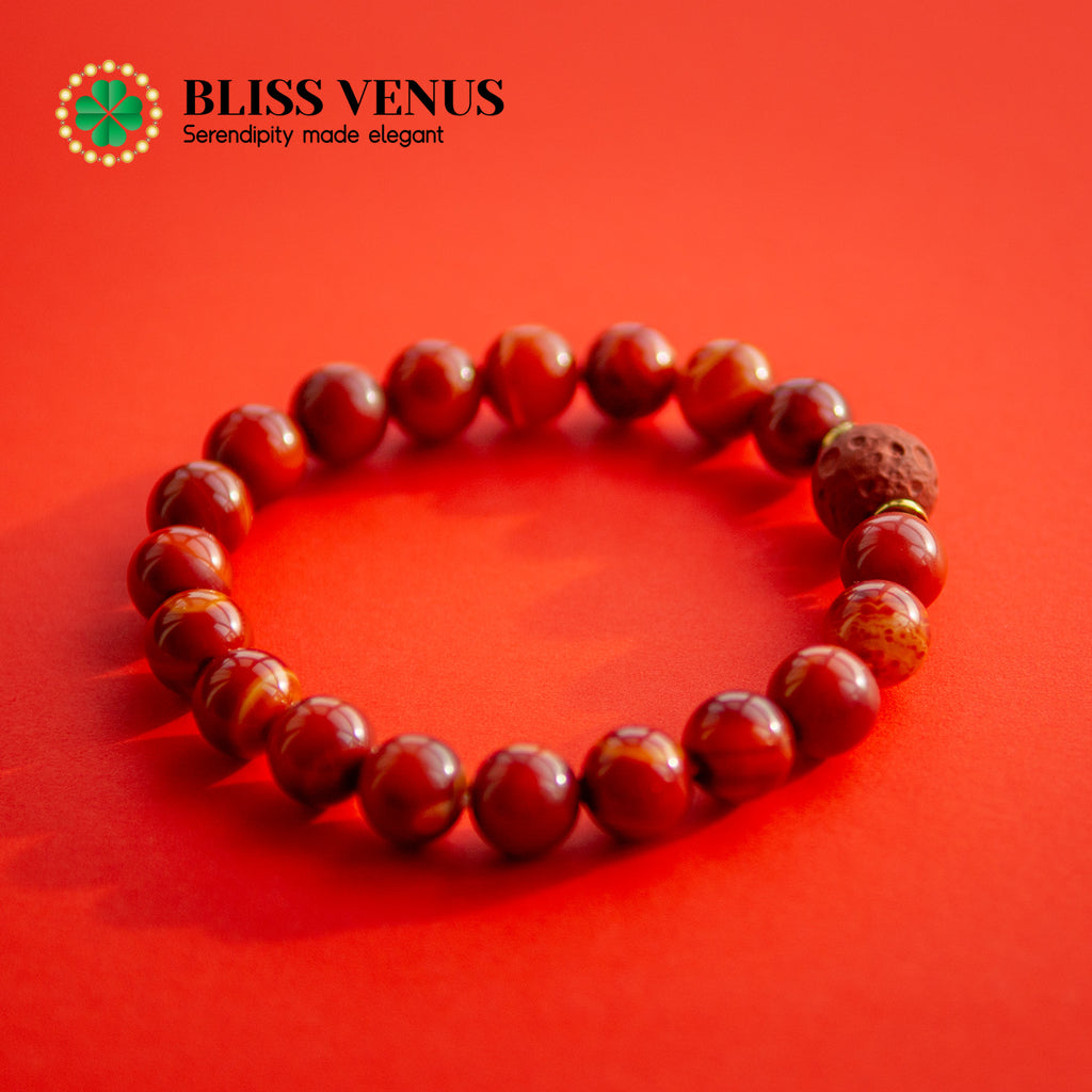 Full view of sun design red agate bracelet, promotes courage and confidence