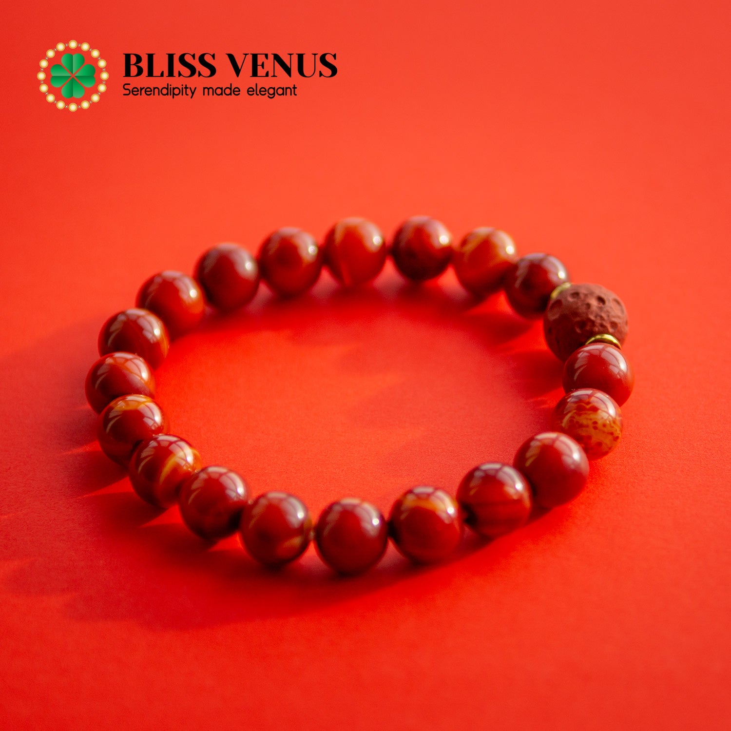 Full view of sun design red agate bracelet, promotes courage and confidence