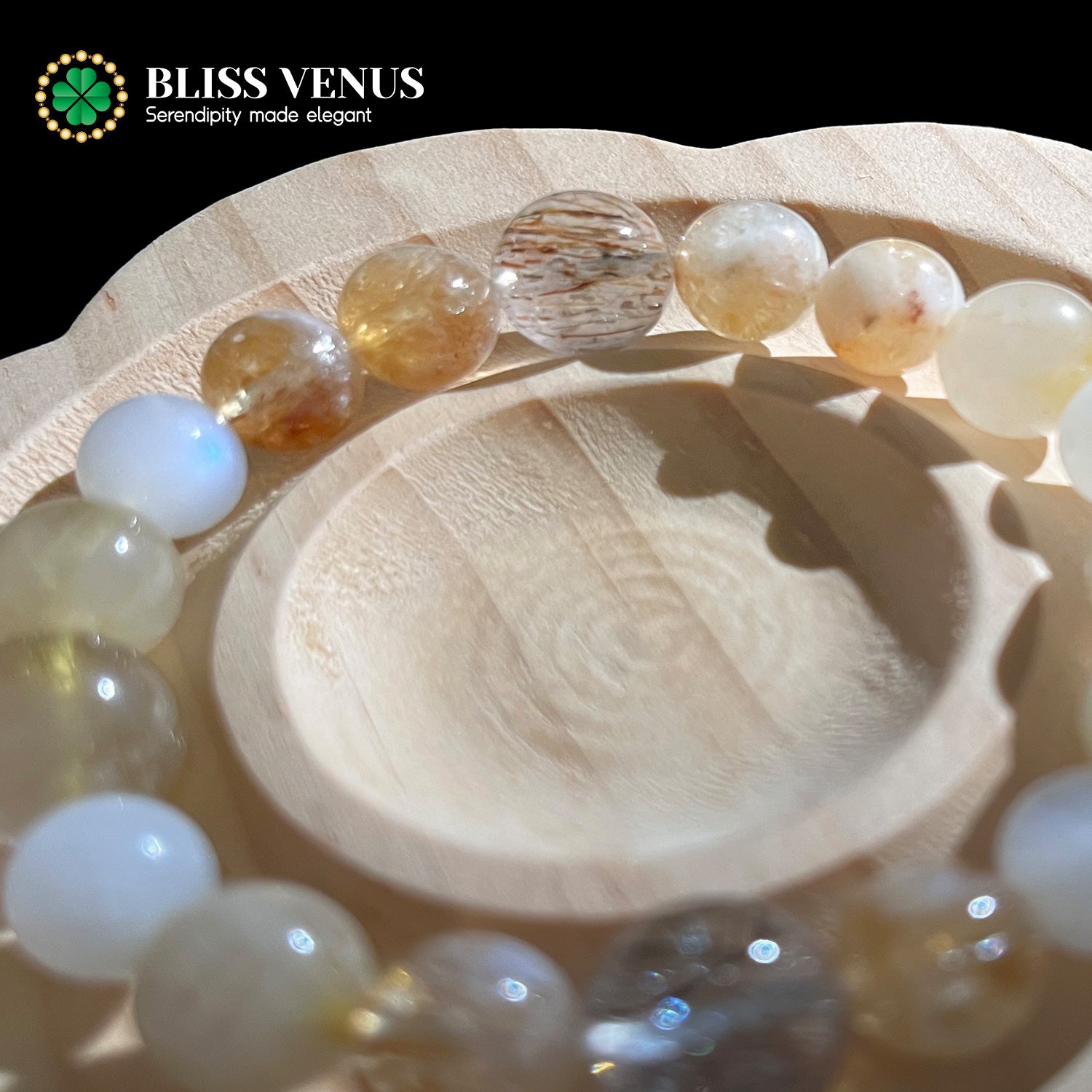 Golden rutile crystal and super 7 bracelet displaying full-spectrum energy protection