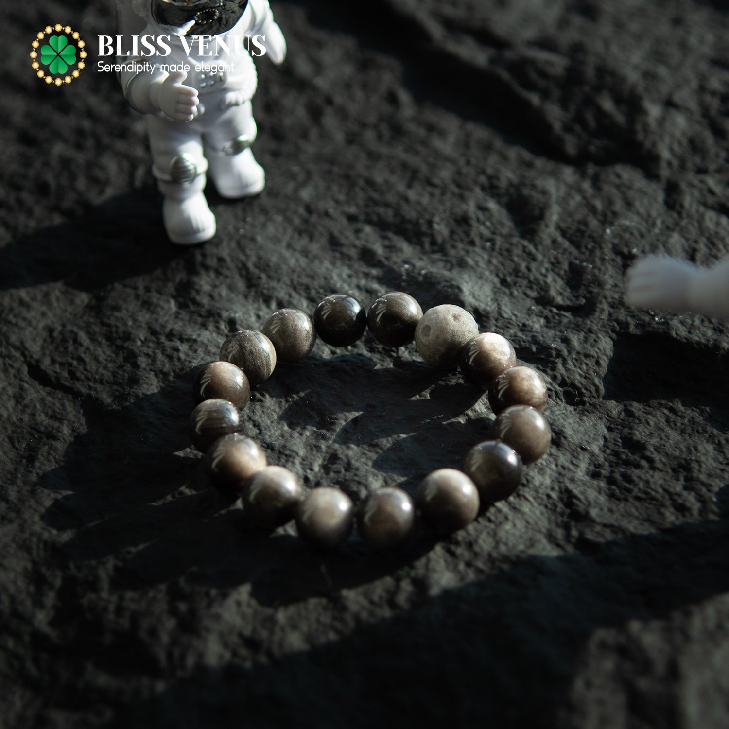 Natural obsidian beaded bracelet worn on wrist, available in 16-20cm sizes