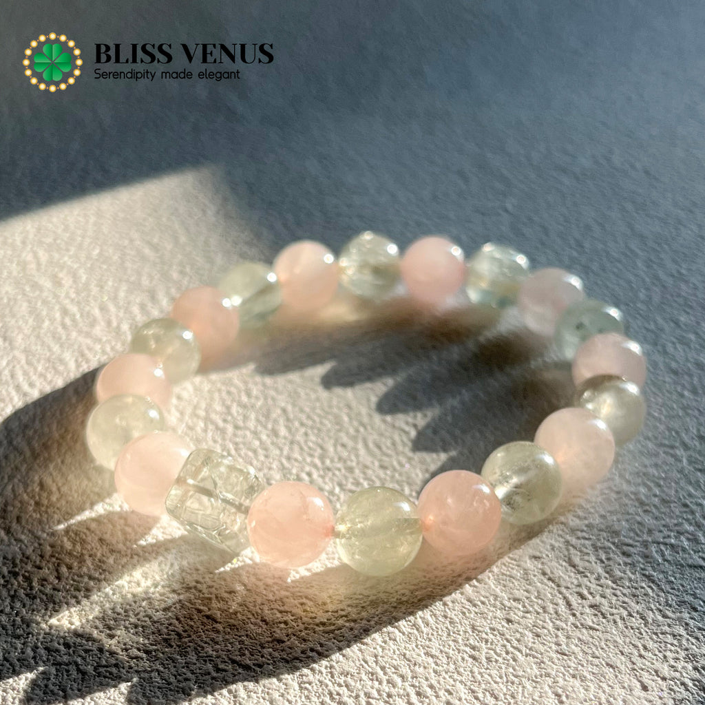 Natural pink and green crystal beaded bracelet worn on wrist, heart chakra energy stones
