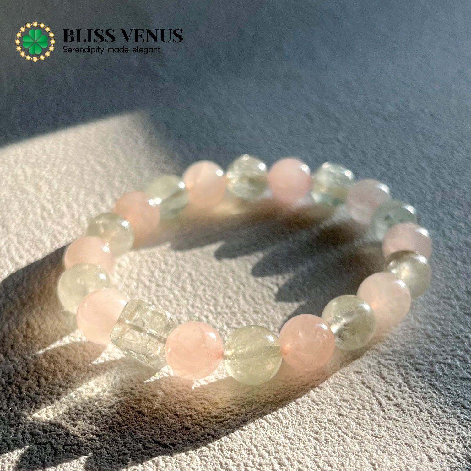 Natural pink and green crystal beaded bracelet worn on wrist, heart chakra energy stones