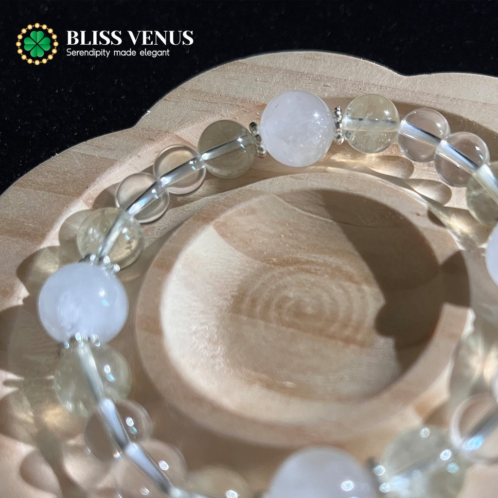 Natural white and yellow crystal beaded bracelet worn on wrist, wealth stone and purity combination