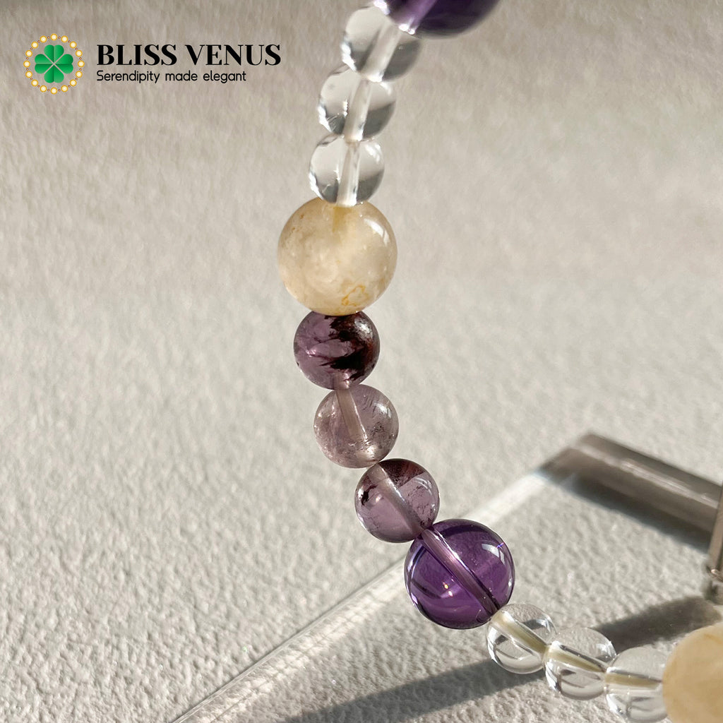 Natural yellow white purple crystal beaded bracelet worn on wrist, harmonious energy field
