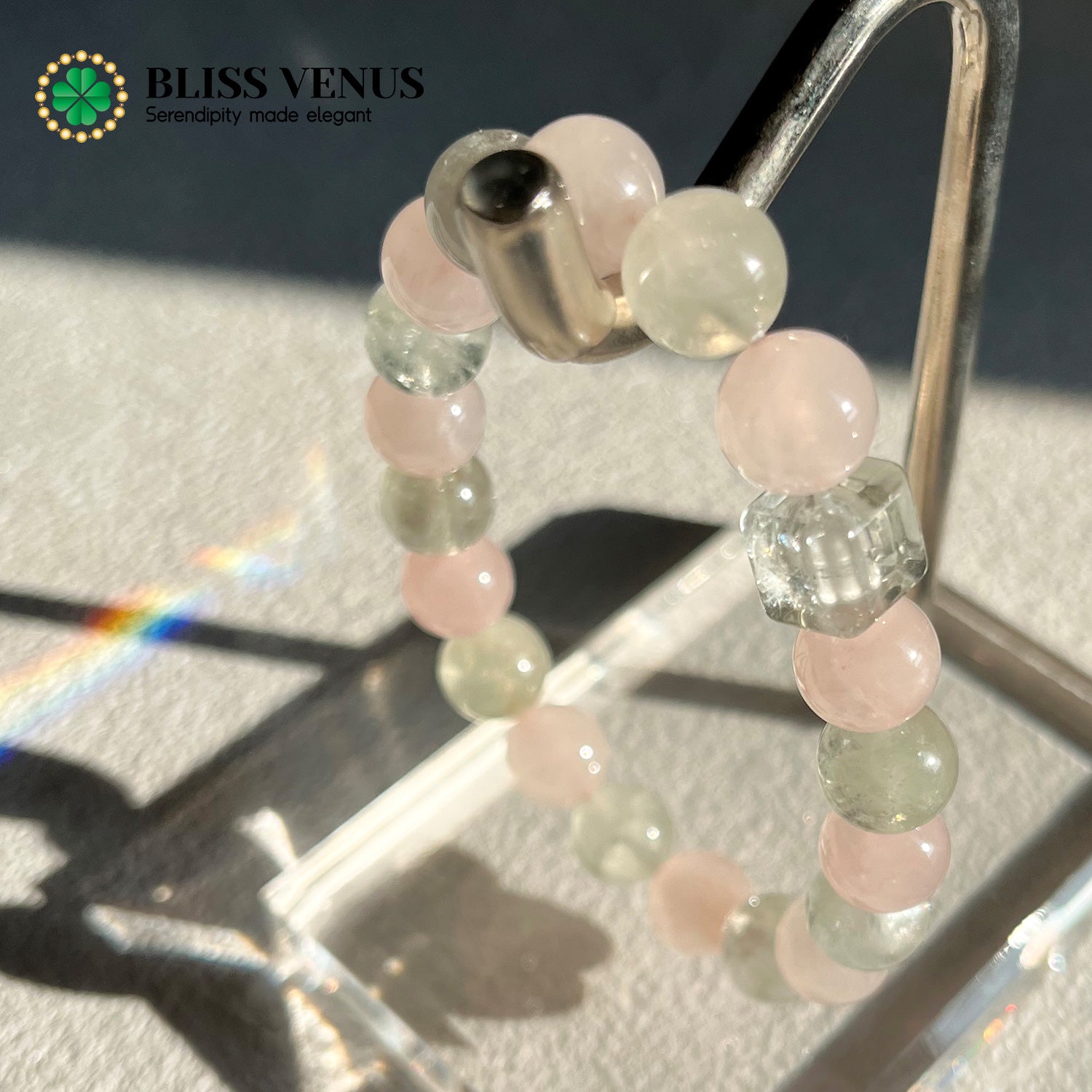 Pink crystal and green crystal bracelet detail view displaying stone of love and vitality combination