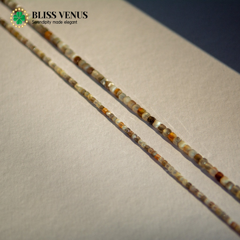 Side angle of lucky star agate necklace displaying bead size variation and gold clasp detail