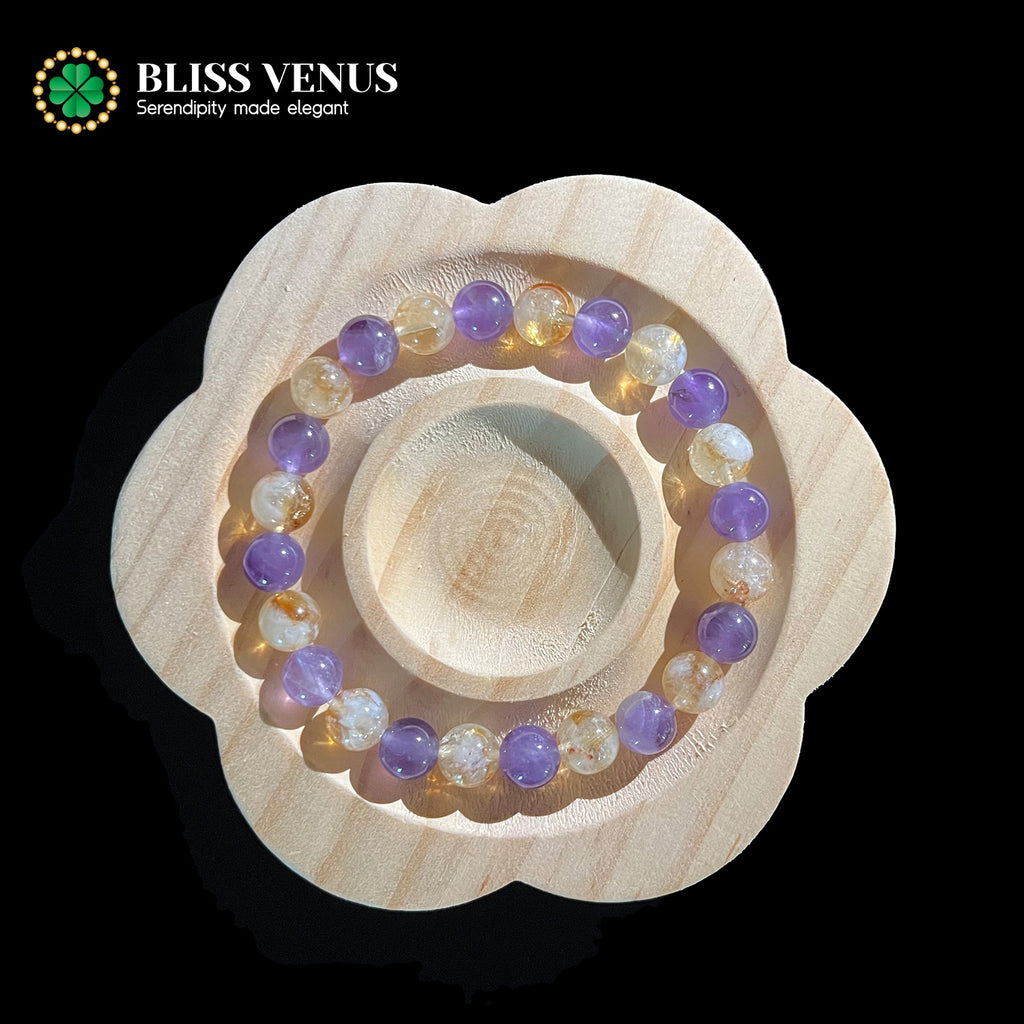 Side angle of purple yellow crystal bracelet showing calm thinking and wealth creation energy