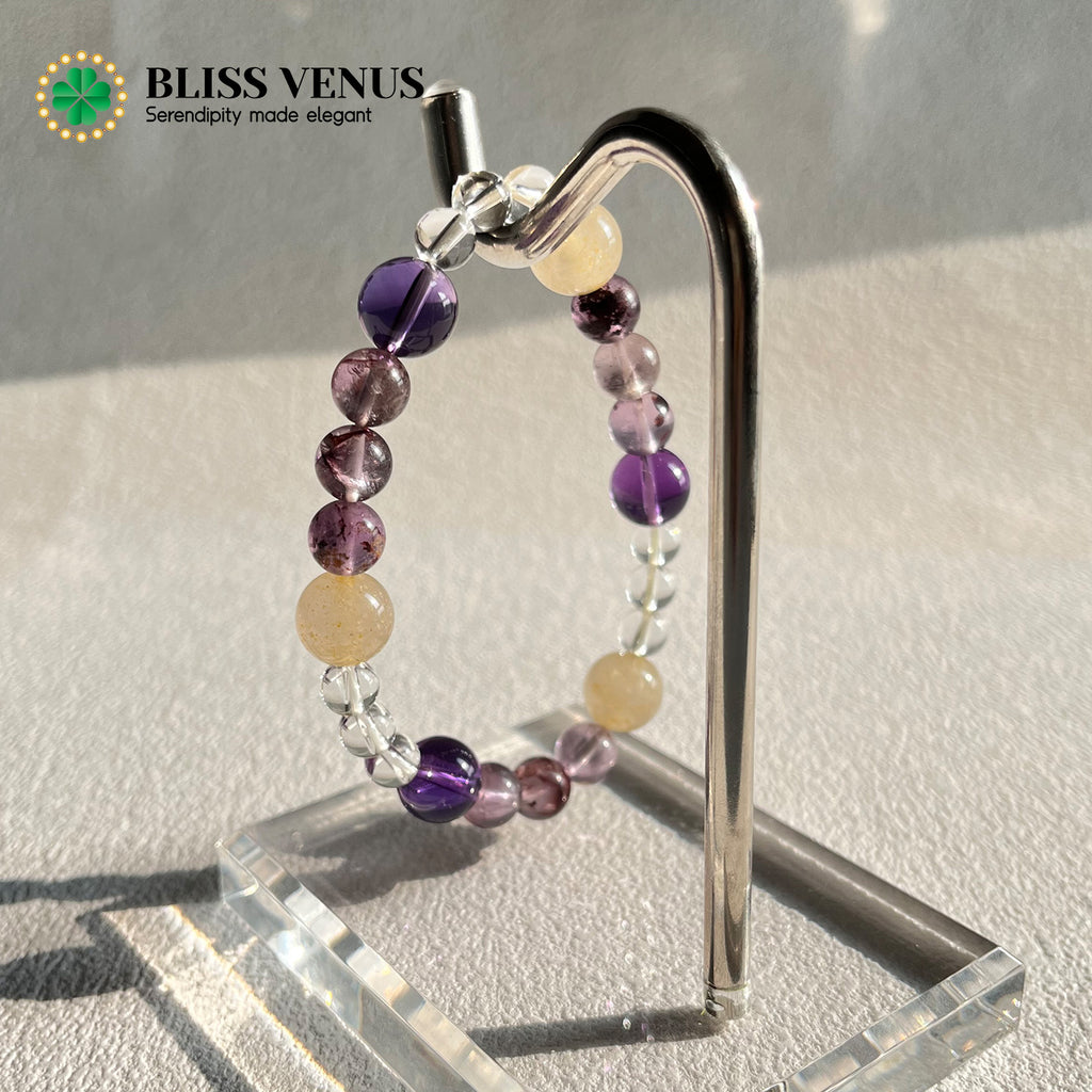 Yellow white purple crystal bracelet detail view displaying wealth wisdom and purity stone combination